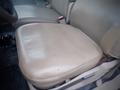 A beige leather seat from a 2008 Ford F-550 showing signs of wear with a smooth surface and slight discoloration