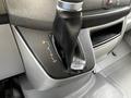 Close-up of the gear shift lever in a 2017 Mercedes-Benz Sprinter with a leather boot and drive mode indicators P R N D