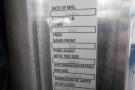 A 2015 Kenworth T660 displaying a manufacturing label with specifications including date of manufacture, GVWR, and tire size details