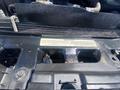 Close-up view of the engine compartment of a 2016 Ford F-350 SD highlighting various engine components and manufacturer labels