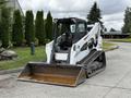 A 2017 Bobcat T740 compact track loader with a large bucket in the front and rubber tracks for mobility