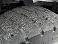 Close-up of a heavily worn tire tread from a 2017 International WorkStar 7600 showing grooves and cracks in the rubber surface