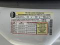 A 2008 Ford F-250 SD with a tire and loading information label detailing tire sizes and pressure specifications