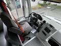 Interior of a 2015 Spartan School Bus featuring a driver's seat with a safety belt dashboard controls and steering wheel