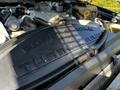 Engine cover of a 2008 Ford F-550 featuring the words Power Stroke V8 Turbo Diesel