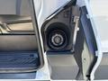 A 2016 Ford Transit with the fuel door open revealing the fuel cap inside the compartment