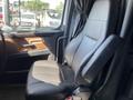 Interior of a 2022 Freightliner Cascadia showing a black driver's seat with armrest and dashboard elements in the cab