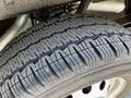 Close-up of a tire from a 2023 Ford Transit showcasing its tread pattern and rubber material