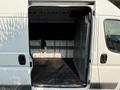 A 2017 RAM Promaster with an open rear door revealing a spacious cargo area featuring a flat rubber floor and metal walls