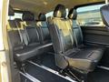 A 2022 Mercedes-Benz Metris with a spacious interior featuring black leather seats arranged in a row with seat belts visible