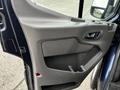 Interior door panel of a 2020 Ford Transit featuring armrest and storage compartment