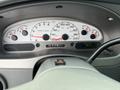 Dashboard of a 2004 Ford Explorer Sport Trac displaying speedometer and tachometer readings along with fuel and temperature gauges