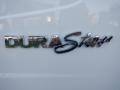 A chrome emblem displaying the word DURAStar on a white vehicle
