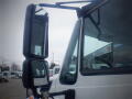 Close-up of the side mirrors on a 2016 International 7400 truck showing the large mirror and smaller convex mirror