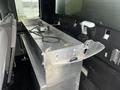 A 2017 Ford F-150 truck with an aluminum storage box installed in the rear cabin area