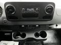 Dashboard of a 2020 Mercedes-Benz Sprinter featuring a radio display climate controls and cup holders