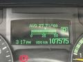 Dashboard display of a 2015 Mitsubishi Fuso FE showing average fuel consumption, time, and odometer reading