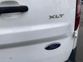 White 2017 Ford Transit Connect with XLT badge on the rear above the Ford emblem
