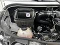 A 2019 Mercedes-Benz Sprinter engine compartment showcasing the air filter housing and various engine components
