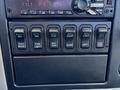 The image shows the control panel of a 2018 International DuraStar featuring multiple switches for functionalities like brake fog light dump and suspension settings