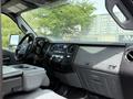 Interior of a 2013 Ford F-550 featuring a dashboard with controls and a Super Duty emblem