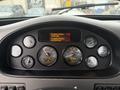 Dashboard of a 2016 Peterbilt 348 featuring gauges and an engine display with various readings and the engine make and model information