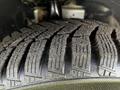 Close-up of a tire tread on a 2016 Ford Transit Connect showcasing deep channels and patterns designed for traction and grip