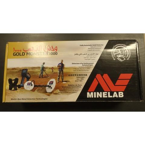 A MINELAB Gold Monster 1000 Gold Detector displayed on a packaging box featuring images and text related to metal detection technology