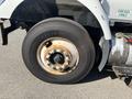A close-up of a wheel from a 2007 International 7300 featuring a Michelin tire with visible rust on the rim and lug nuts