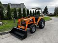 2001 Agco ST40 tractor with a front loader and black scoop attachment in an orange and gray color scheme