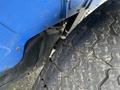 A blue 2007 New Holland TN70A tractor tire with a detailed tread pattern visible showing wear and grooves