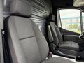 Interior of a 2019 Mercedes-Benz Sprinter showing two driver seats with fabric upholstery and a minimalist design
