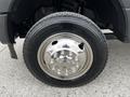 A close-up of a chrome wheel and tire from a 2019 Ford F-550 showcasing its shiny rim and tread pattern