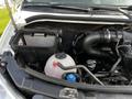 A 2017 Mercedes-Benz Sprinter engine compartment showing the air filter, coolant reservoir, and various engine components