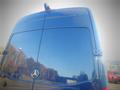 A blue 2017 Mercedes-Benz Sprinter van showcasing its rear doors and emblem