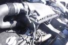 Close-up of a 2012 Mercedes-Benz Sprinter engine component showcasing various hoses and a plastic intake manifold