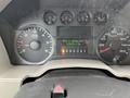 Dashboard of a 2010 Ford F-250 SD showing RPM gauges and a digital display with trip mileage and gear indicator