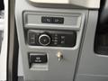 Control panel of a 2021 Ford F-150 featuring knobs and buttons for lights and other functions
