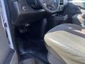 Interior view of a 2016 GMC Savana showing the driver's seat floor area steering wheel and dashboard controls