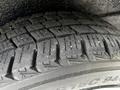 Close-up of a tire from a 2020 Nissan NV200 showcasing its tread pattern and details