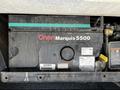 An Onan Marquis 5500 generator located within a compartment of a 2000 Ford Motorhome