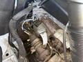 A 2016 Mercedes-Benz Sprinter engine compartment showing the turbocharger and its components including pipes and wires