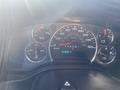 Dashboard of a 2012 GMC Savana showing speedometer and various gauges for temperature fuel pressure and mileage