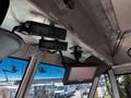 Interior view of a 2019 Freightliner MT45 showing two mounted cameras and a monitor on the dashboard