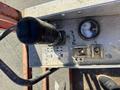 A control panel of a 2010 SkyJack SJ featuring a joystick, power switch, and a gauge displaying levels