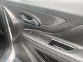 Interior door panel of a 2018 Buick Encore featuring a handle and power window controls