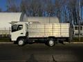 2014 Mitsubishi Fuso FE truck with a metallic flatbed viewed from the side