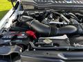 A 2018 Ford F-550 engine compartment showcasing the engine components including the air intake system and battery