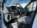 Interior view of a 2017 Ford Transit showcasing the dashboard seats and steering wheel with a focus on functional design and spaciousness