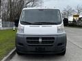 A 2018 RAM Promaster van with a white and black exterior facing forward with a prominent grille and headlights visible